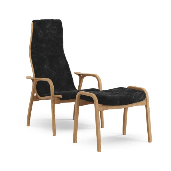 Swedese Lamino armchair and footstool Sheepskin Black-oiled oak